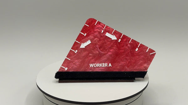 Red and black tool with 'WORKER A' branding on a white platform against a gray background