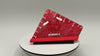 Red shoe with 'WORKER A' branding on a white platform against a gray background