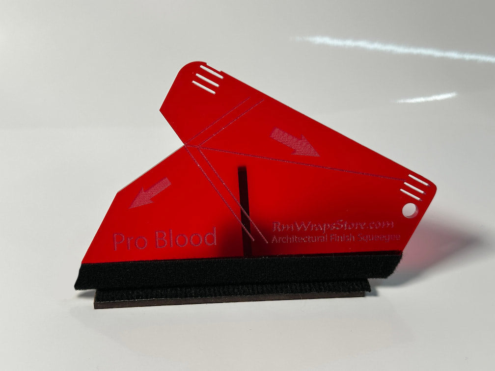 Red blood sample collection device on a white background