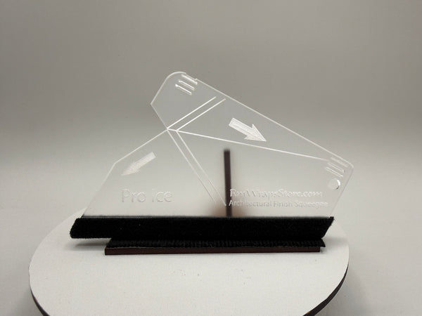 Clear acrylic object on a white stand with a gray background