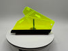 Yellow plastic tool on a white platform with a gray background