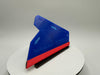 Blue and red triangular object on a white stand with a gray background