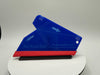 Blue and red squeegee on a white platform with a gray background