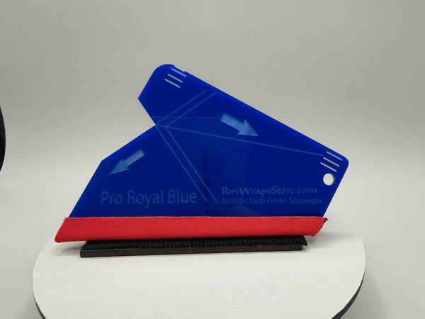 Blue and red squeegee on a white platform with a gray background