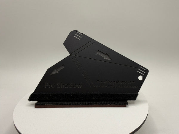 Black shadow box on a white platform with a gray background