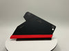 Black and red tool on a white platform with a gray background