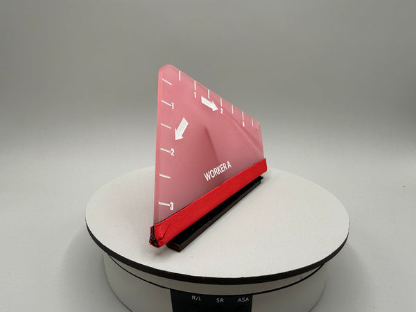 Red and black device on a white platform with a gray background
