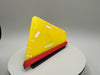 Triangular tool with yellow and red colors on a gray background