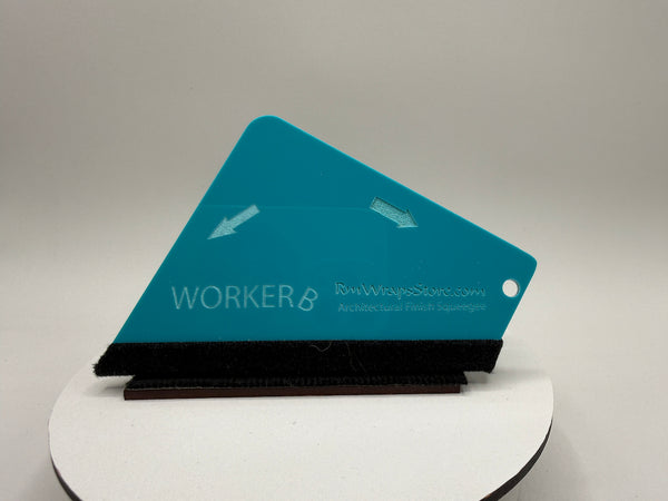 Teal architectural scale model on a gray background