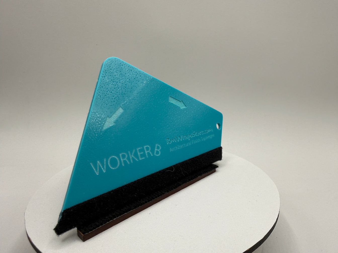 Teal squeegee with 'WORKER.B' branding on a gray background