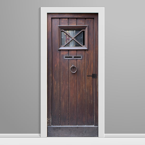 Wooden door with glass panel and mail slot on a gray background