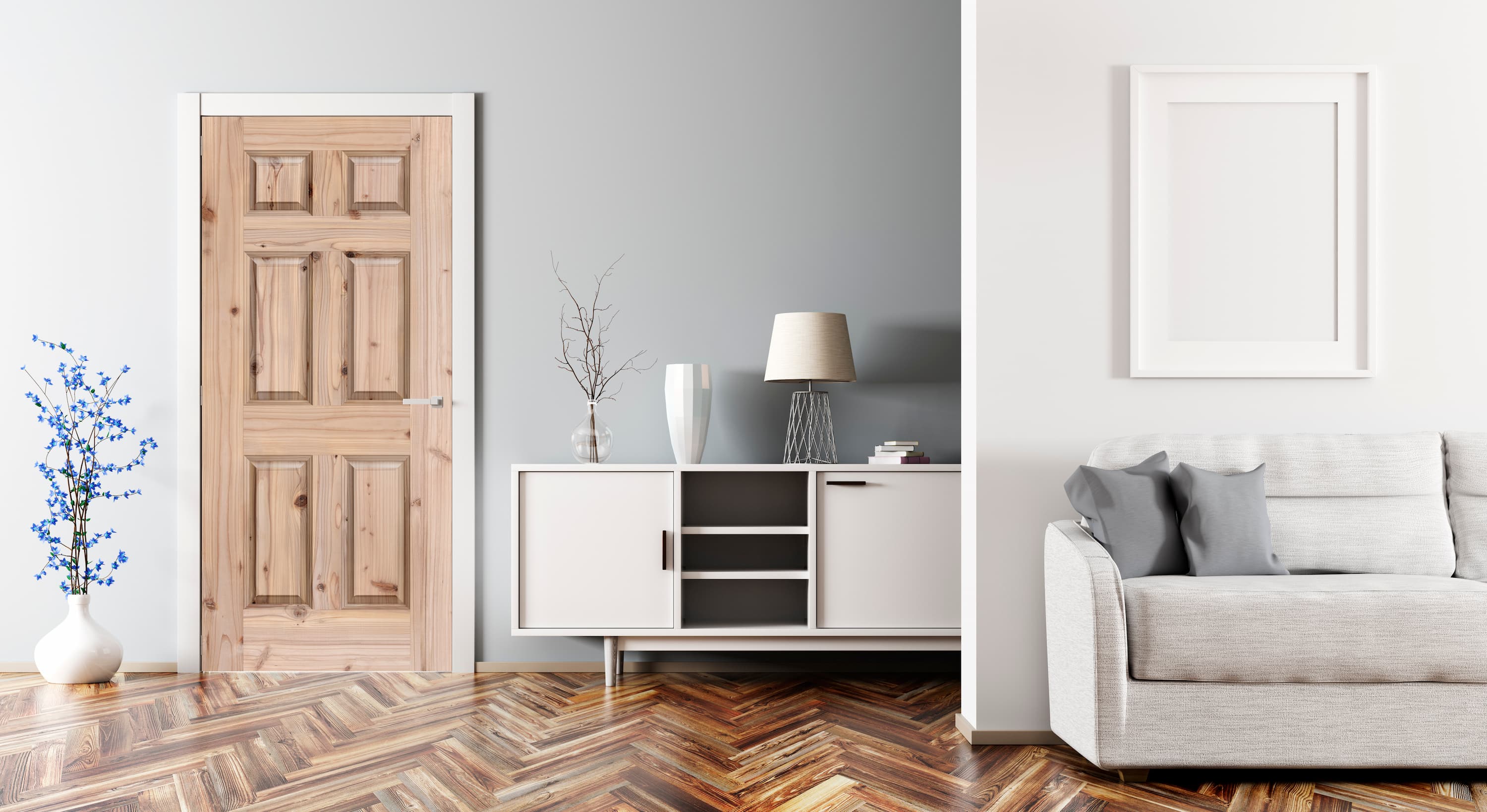 Modern living room with a gray sofa, white cabinet, and wooden floor.