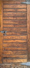 Close-up of a wooden door with visible grain and texture