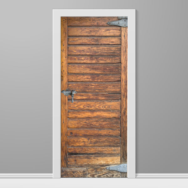 Wooden door with metal handles on a gray wall