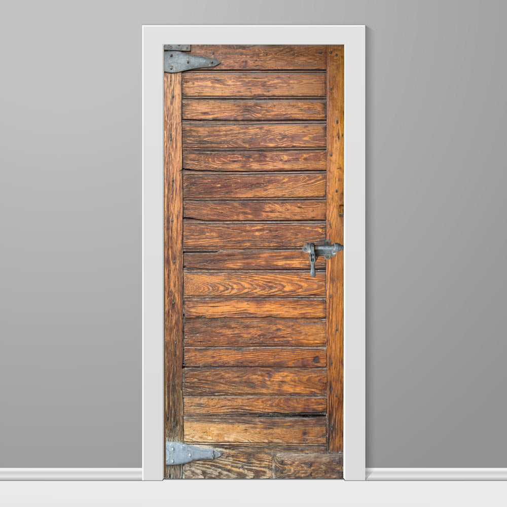 Wooden door with metal handles on a gray wall