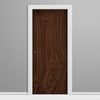 Wooden door with white frame on a gray background
