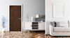Modern living room with a wooden door, white cabinet, and gray sofa.