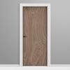 Wooden door with white frame on a gray background