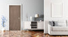Modern living room with a wooden door, white cabinet, and gray sofa.